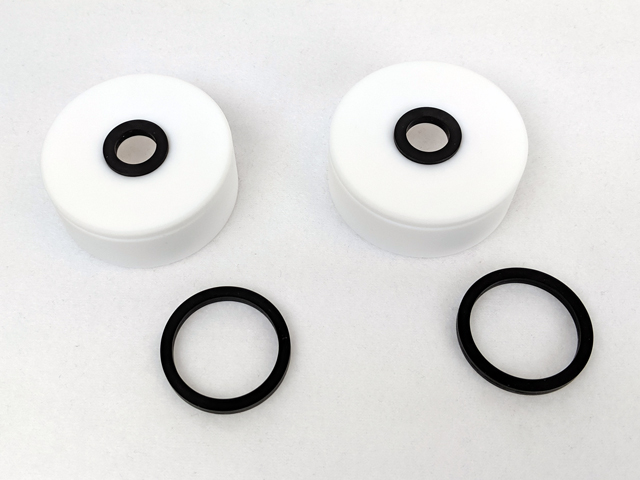 Half cell “pucks” (1 cm2 bore area) with O-rings