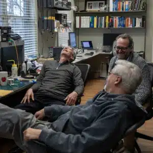 Engineers in Discussion and Laughing