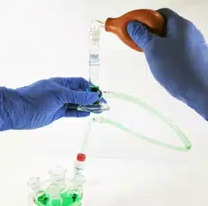 Applying back pressure to fill tube and reservoir